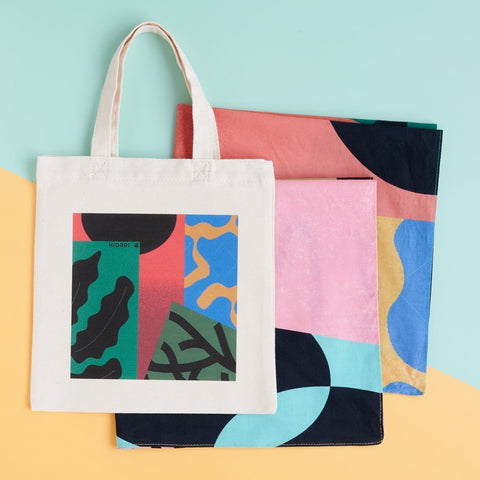 On the go planner mini tote bag with both green and beige versions of the vibrant flora handkerchief