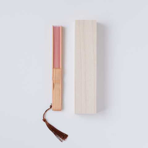 Left-handed folding fan with silk fabric and light brown bamboo ribs, includes cloth case and wooden gift box.