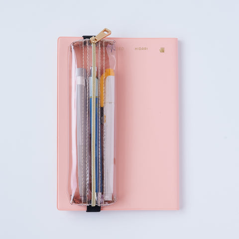 Book strap pencil case with adjustable band, clear PVC, holds 3–4 pens, Japan-made notebook accessory.