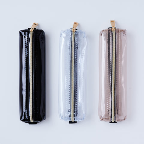 Book strap pencil case with adjustable band, clear PVC, holds 3–4 pens, Japan-made notebook accessory.