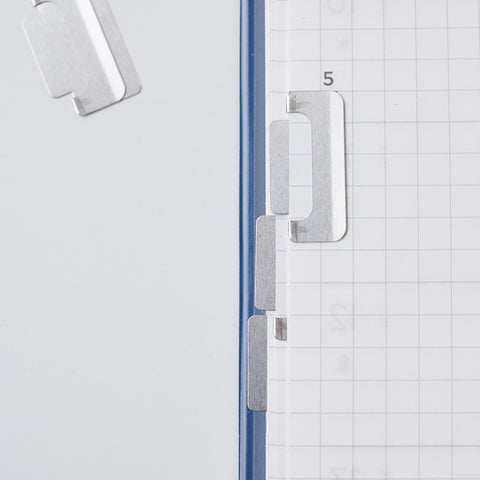 Slim metal index clips in silver and copper, 8-pack, designed by MIDORI for planners and notebooks.