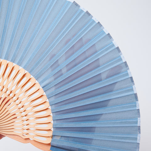 Left-handed folding fan with silk fabric and light brown bamboo ribs, includes cloth case and wooden gift box.