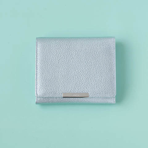 Left-handed wallet in ice blue embossed leather with spacious coin pocket and 12 card slots, handcrafted by Yamato Tokyo.