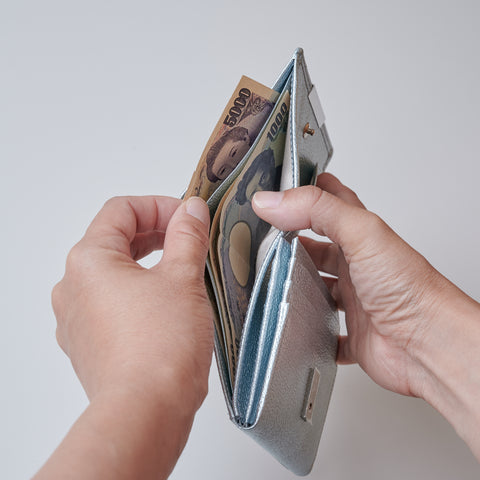 Left-handed wallet in ice blue embossed leather with spacious coin pocket and 12 card slots, handcrafted by Yamato Tokyo.