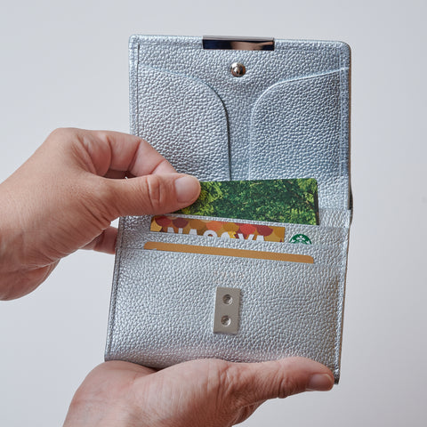 Left-handed wallet in ice blue embossed leather with spacious coin pocket and 12 card slots, handcrafted by Yamato Tokyo.