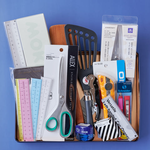 Complete gift set of left-handed tools including kitchenware and stationery, packed in an original designer tin box.