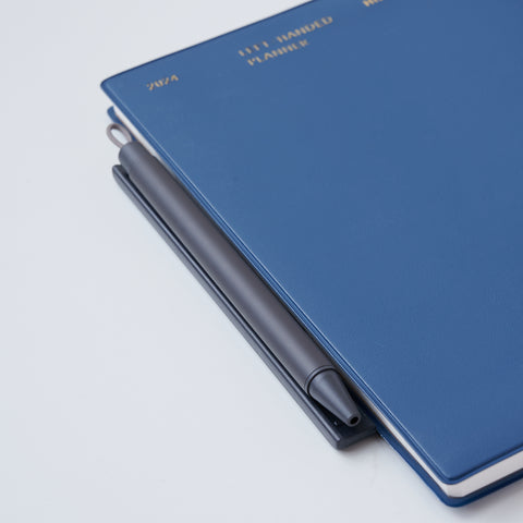 Magnet holder ballpoint pen set in white, black, orange, and blue-grey, by ZEBRA Japan.