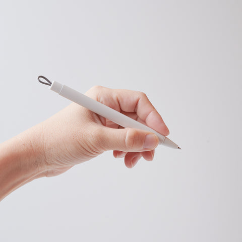 Magnet holder ballpoint pen set in white, black, orange, and blue-grey, by ZEBRA Japan.