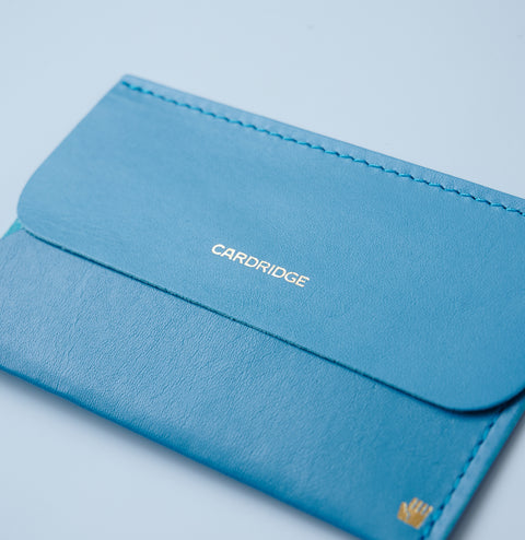 Ultra-thin left-handed leather card holder in cobalt blue, holds about 5 cards, made by dünn in Japan.