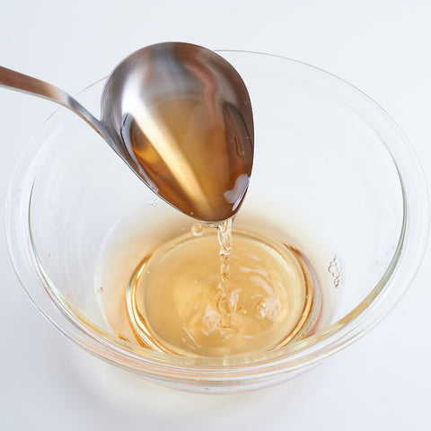 Left-handed side-pour soup ladle made of 18-8 stainless steel, 75ml capacity, crafted in Japan.