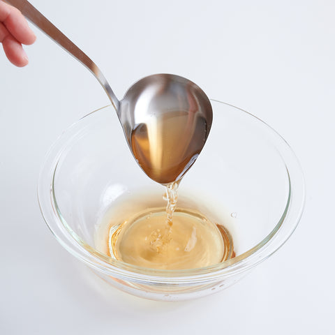 Left-handed side-pour soup ladle made of 18-8 stainless steel, 75ml capacity, crafted in Japan.
