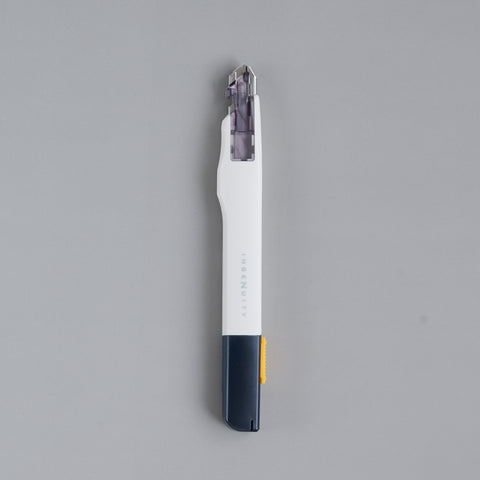 Precision utility knife with 30-degree blade, ergonomic grip, suitable for both left- and right-handed users, designed in Japan.