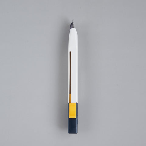 Precision utility knife with 30-degree blade, ergonomic grip, suitable for both left- and right-handed users, designed in Japan.