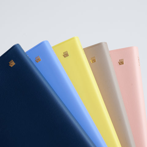 HIDARI 2025 left-handed planner showing reversed weekly layout and colorful cover options, Japan edition.