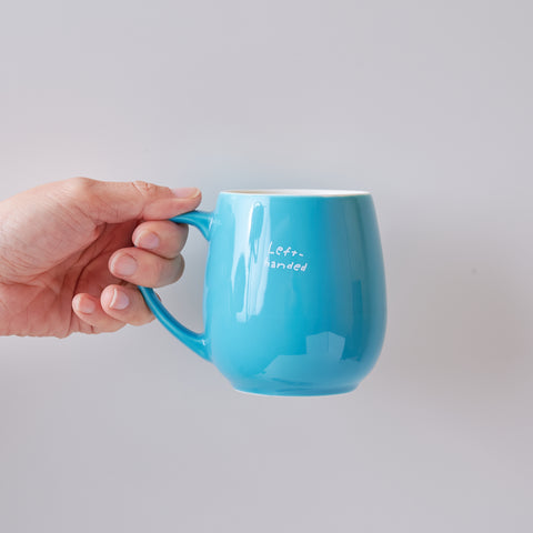 HIDARI left-handed mug with "Left-handed" logo, 320ml, available in pink, yellow, and turquoise blue, made in Japan.