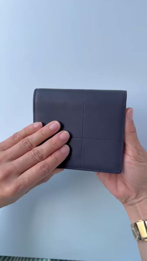 Left-handed wallet in ice blue embossed leather with spacious coin pocket and 12 card slots, handcrafted by Yamato Tokyo.