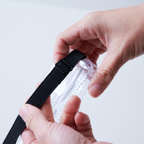 Book strap pencil case with adjustable band, clear PVC, holds 3–4 pens, Japan-made notebook accessory.