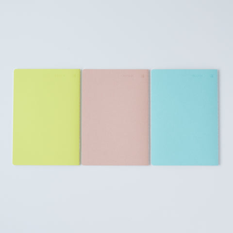 Set of 3 unlined HIDARI notebooks in assorted cover colors, designed for left-handed planners.
