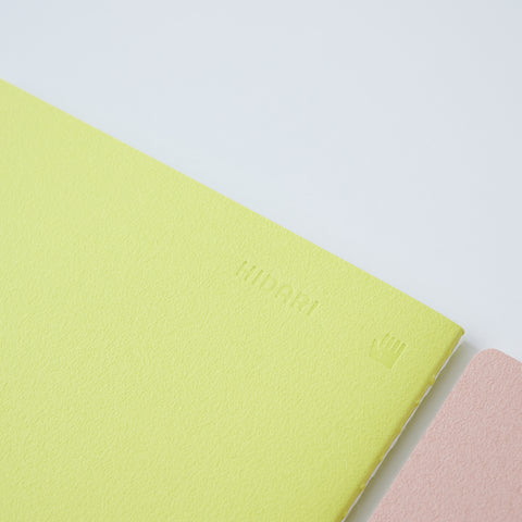 Set of 3 unlined HIDARI notebooks in assorted cover colors, designed for left-handed planners.