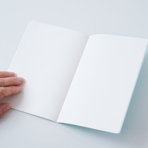 Set of 3 unlined HIDARI notebooks in assorted cover colors, designed for left-handed planners.