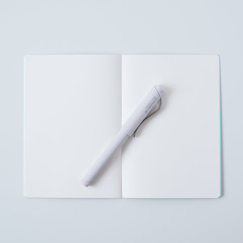 Set of 3 unlined HIDARI notebooks in assorted cover colors, designed for left-handed planners.