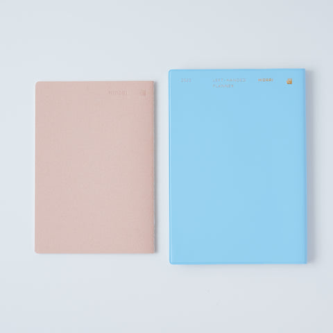 Set of 3 unlined HIDARI notebooks in assorted cover colors, designed for left-handed planners.