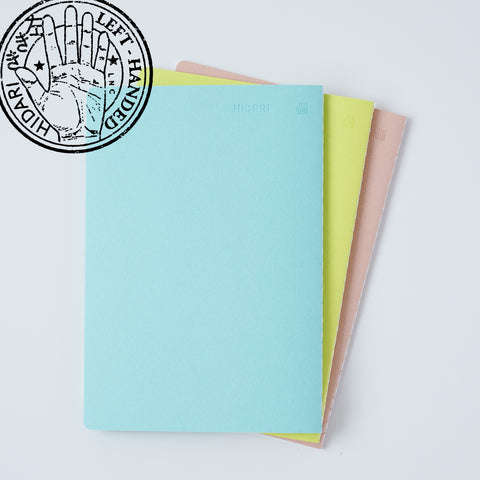 Set of 3 unlined HIDARI notebooks in assorted cover colors, designed for left-handed planners.