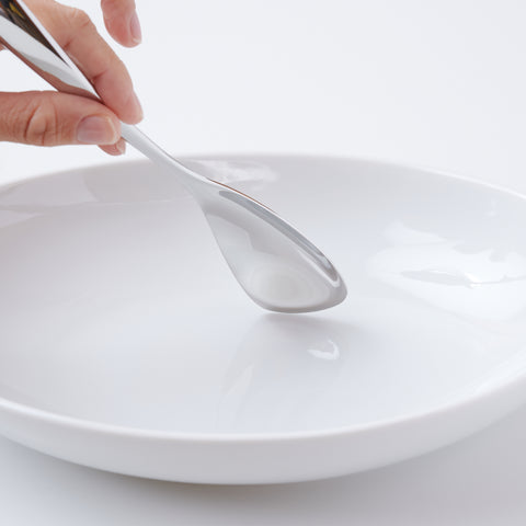 Left-handed stainless steel spoon for curry and rice, polished finish, photographed on white background.
