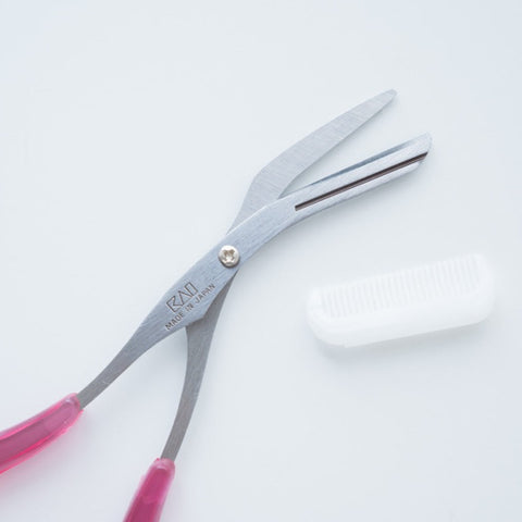 KAI eyebrow scissors for left-handers with detachable comb. Curved blades, ergonomic design, Japanese-made.