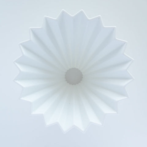 ORIGAMI porcelain coffee dripper with wooden holder, inspired by Japanese origami design.