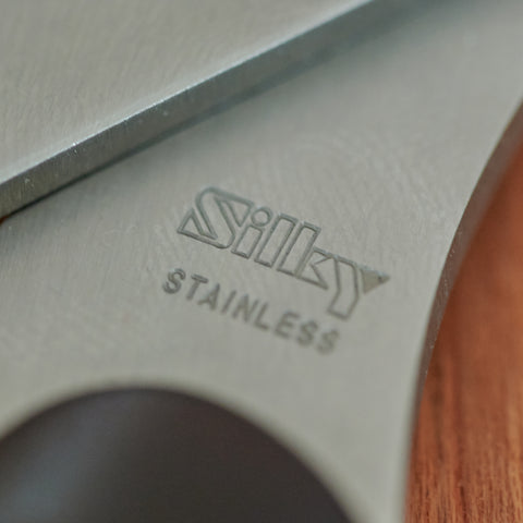 SILKY left-handed fabric scissors. 210mm, stainless steel blades, matte dark brown handles. Made in Seki City, Japan.