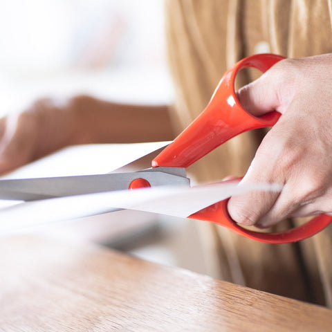 FISKARS left-handed all-purpose scissors with red handles and stainless steel blades, large 210mm size, made in Finland.