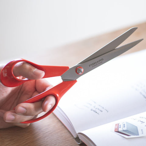 FISKARS left-handed all-purpose scissors with red handles and stainless steel blades, large 210mm size, made in Finland.