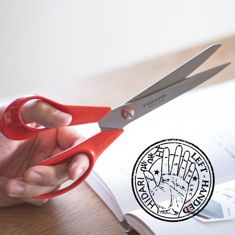 FISKARS left-handed all-purpose scissors with red handles and stainless steel blades, large 210mm size, made in Finland.