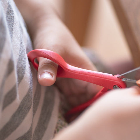 FISKARS kids scissors for left-handed users. Red handles, rounded tips, ergonomic grip, Finnish quality.