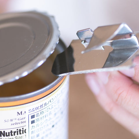 Left-handed can and bottle opener with 4-in-1 stainless steel design, compact size, made in Japan.