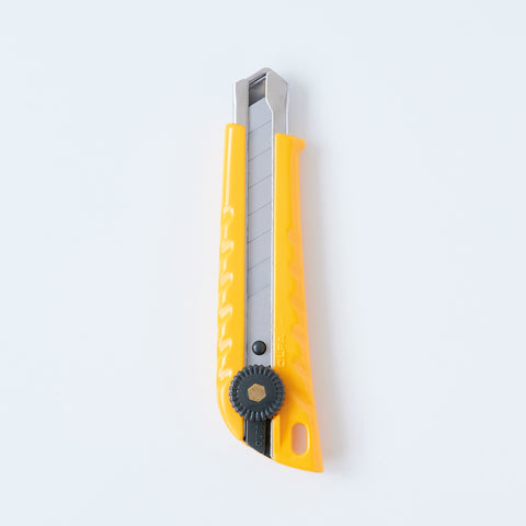 Left-handed OLFA utility knife with ergonomic design, reversed lever for smooth blade operation, includes two replacement blades, suitable for packaging, crafting, and DIY, made in Japan.