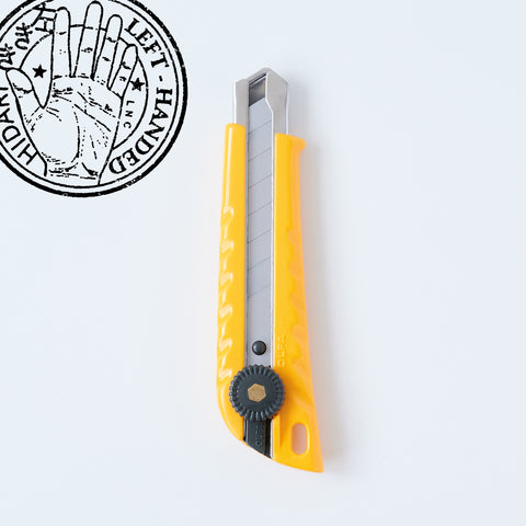 Left-handed OLFA utility knife with ergonomic design, reversed lever for smooth blade operation, includes two replacement blades, suitable for packaging, crafting, and DIY, made in Japan.