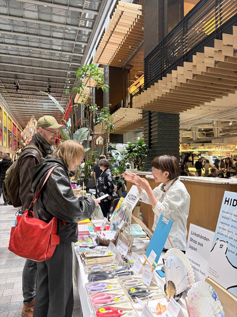 HIDARI's shop manager talking with visitors at the Craftkai Japanese Festival in Berlin
