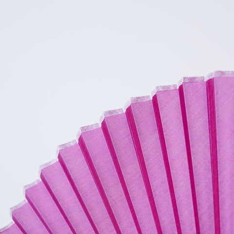 folding fan (with dark brown ribs), left-handed