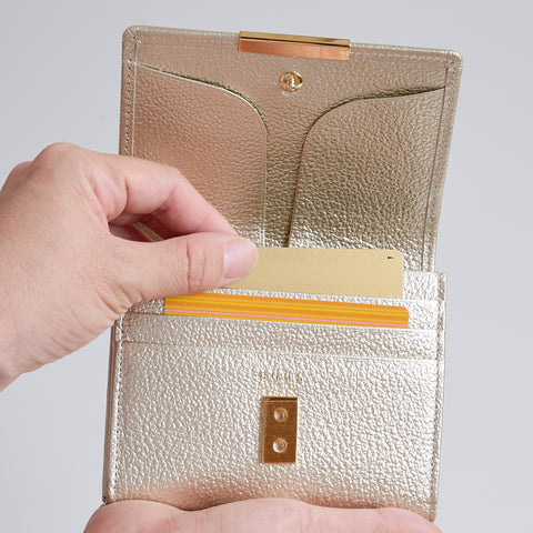 Left-handed Champagne Gold wallet with wide-opening coin pocket, 12 card slots, and reversed bill compartment.