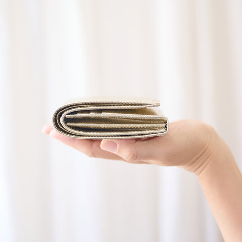 Left-handed wallet in Champagne Gold embossed leather, handcrafted by YAMATOU in Japan.