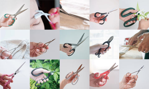 Left-handed scissors from HIDARI, laid out on a wooden table.